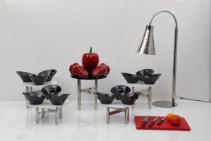Black Serving Bowls on Metal and White Table Risers
