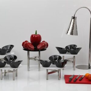 Black Serving Bowls on Metal and White Table Risers